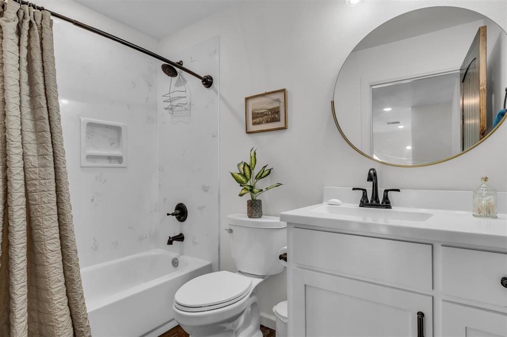 211 Knust Circle Gholson, TX 76705 - Photo 22 of 34 a bathroom with a sink a toilet and a mirror
