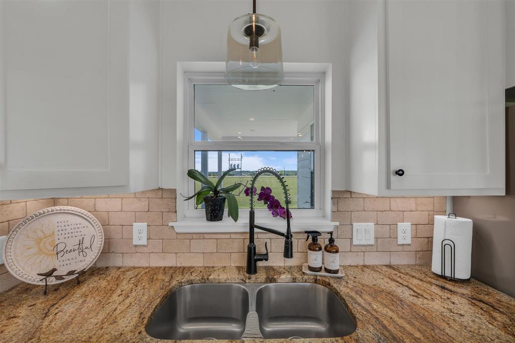 211 Knust Circle Gholson, TX 76705 - Photo 9 of 34 a bathroom with a sink and a mirror