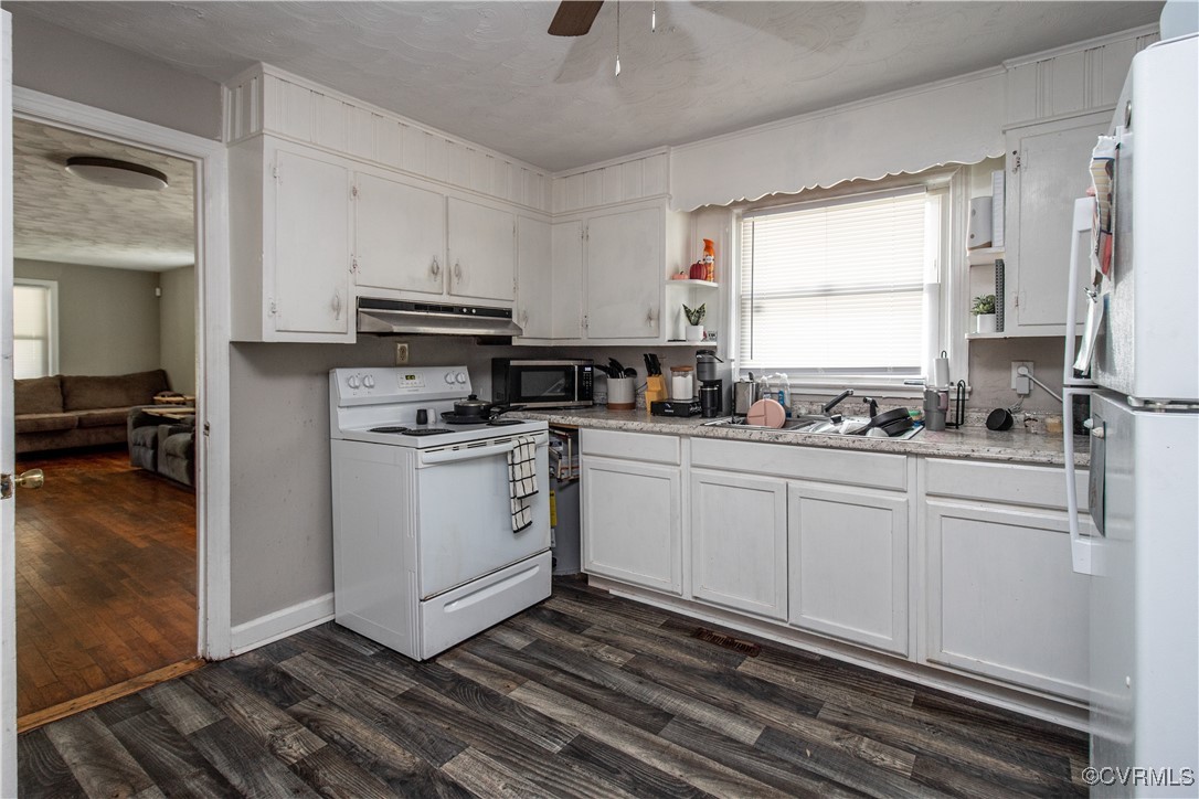 1707 Arlington Road Hopewell, VA 23860 - Photo 4 of 13 a kitchen with cabinets appliances and a window