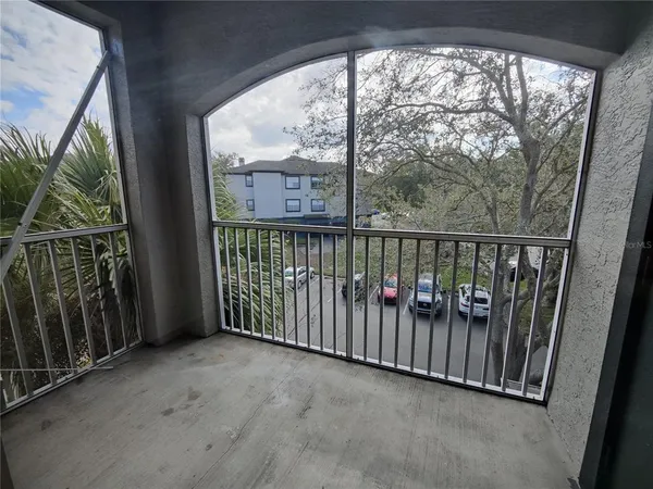 a view of a porch with wooden floor