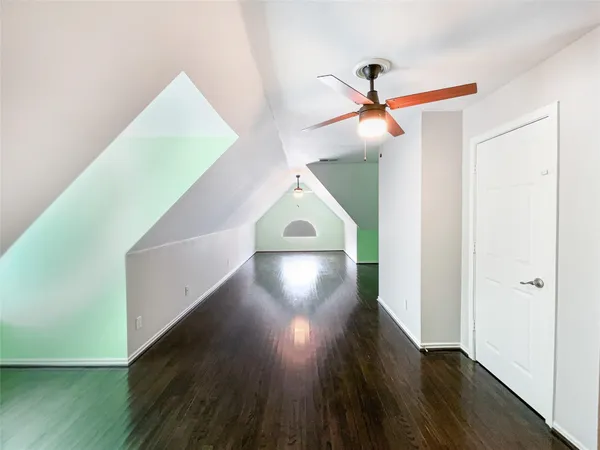 a view of a room with wooden floor