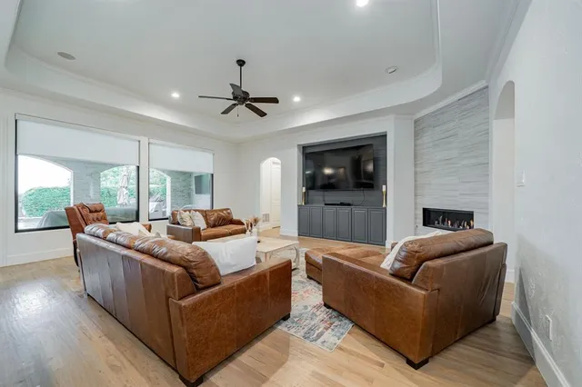 a living room with furniture fireplace and a flat screen tv