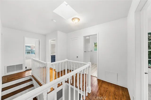 a view of an entryway with wooden floor