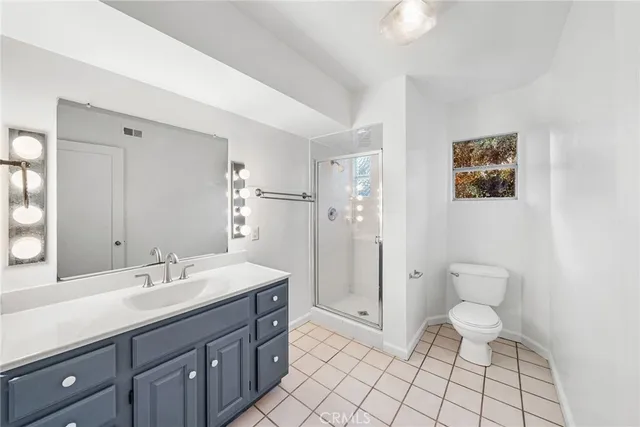 a view of an empty room and a window