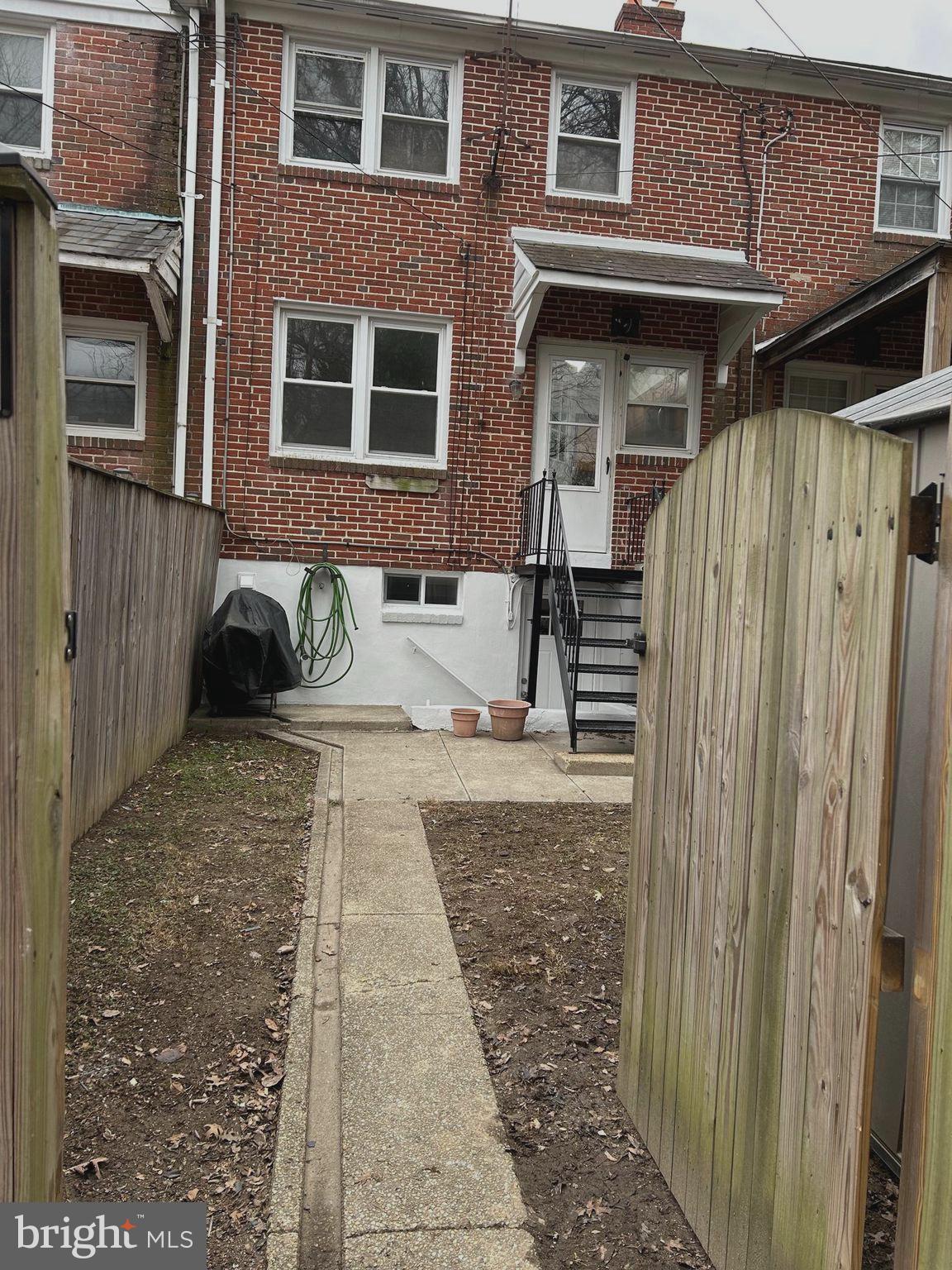 603 Braeside Road Baltimore, MD 21229 - Photo 28 of 30 a view of a brick house with many windows