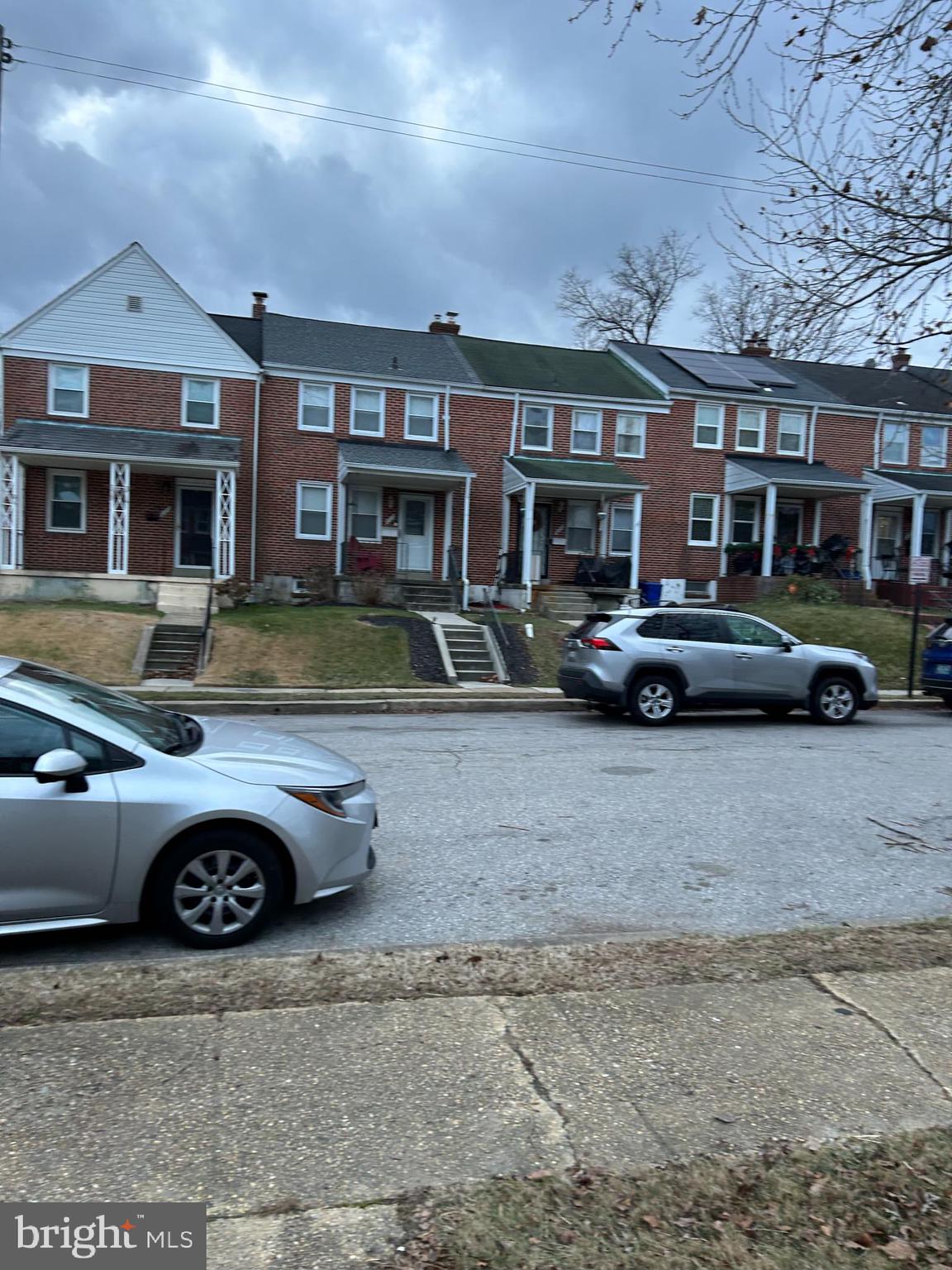 603 Braeside Road Baltimore, MD 21229 - Photo 29 of 30 a front view of a residential apartment building with parking space