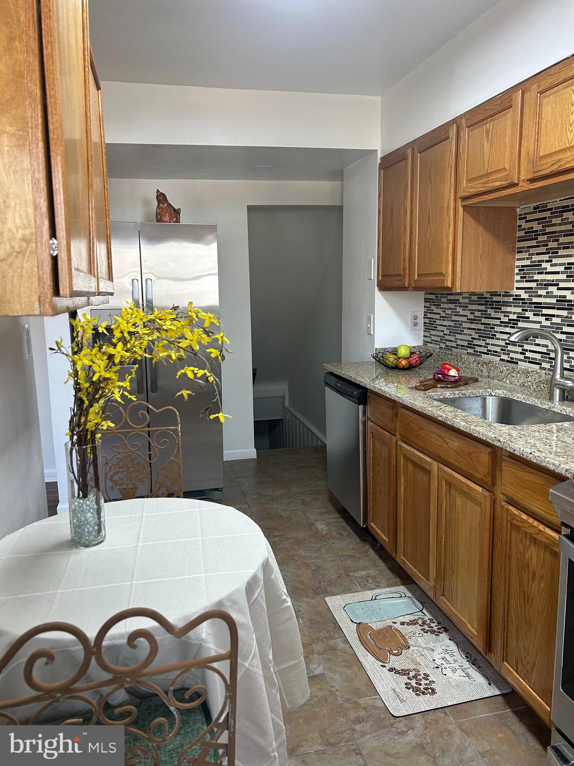 603 Braeside Road Baltimore, MD 21229 - Photo 6 of 30 a kitchen with a stove a refrigerator and a sink