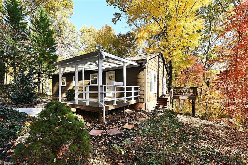 3390 Wide Country Road Pfafftown, NC 27040 - Photo 1 of 50 Covered front porch and view of the wrap around deck