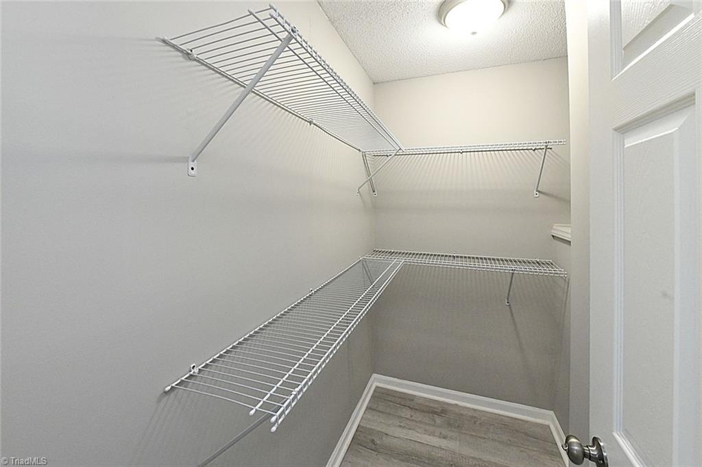 3390 Wide Country Road Pfafftown, NC 27040 - Photo 23 of 50 Walk in closet in primary bedroom