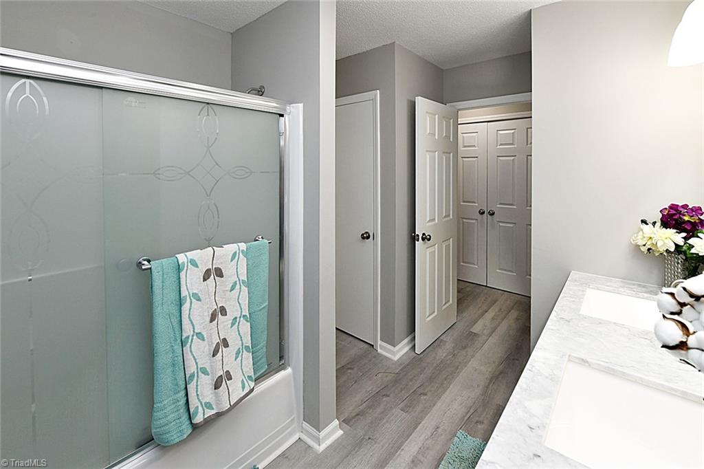 3390 Wide Country Road Pfafftown, NC 27040 - Photo 25 of 50 Hall bathroom has linen closet and is also connected to bedroom #2
