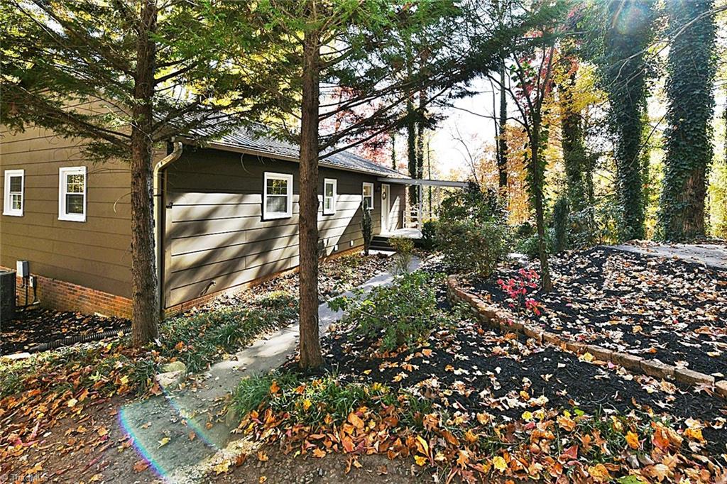 3390 Wide Country Road Pfafftown, NC 27040 - Photo 9 of 50 Concrete walkways to the house with lots of lush landscaping!