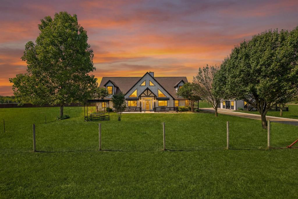 Gable roofline residence with a broad lawn and mature trees