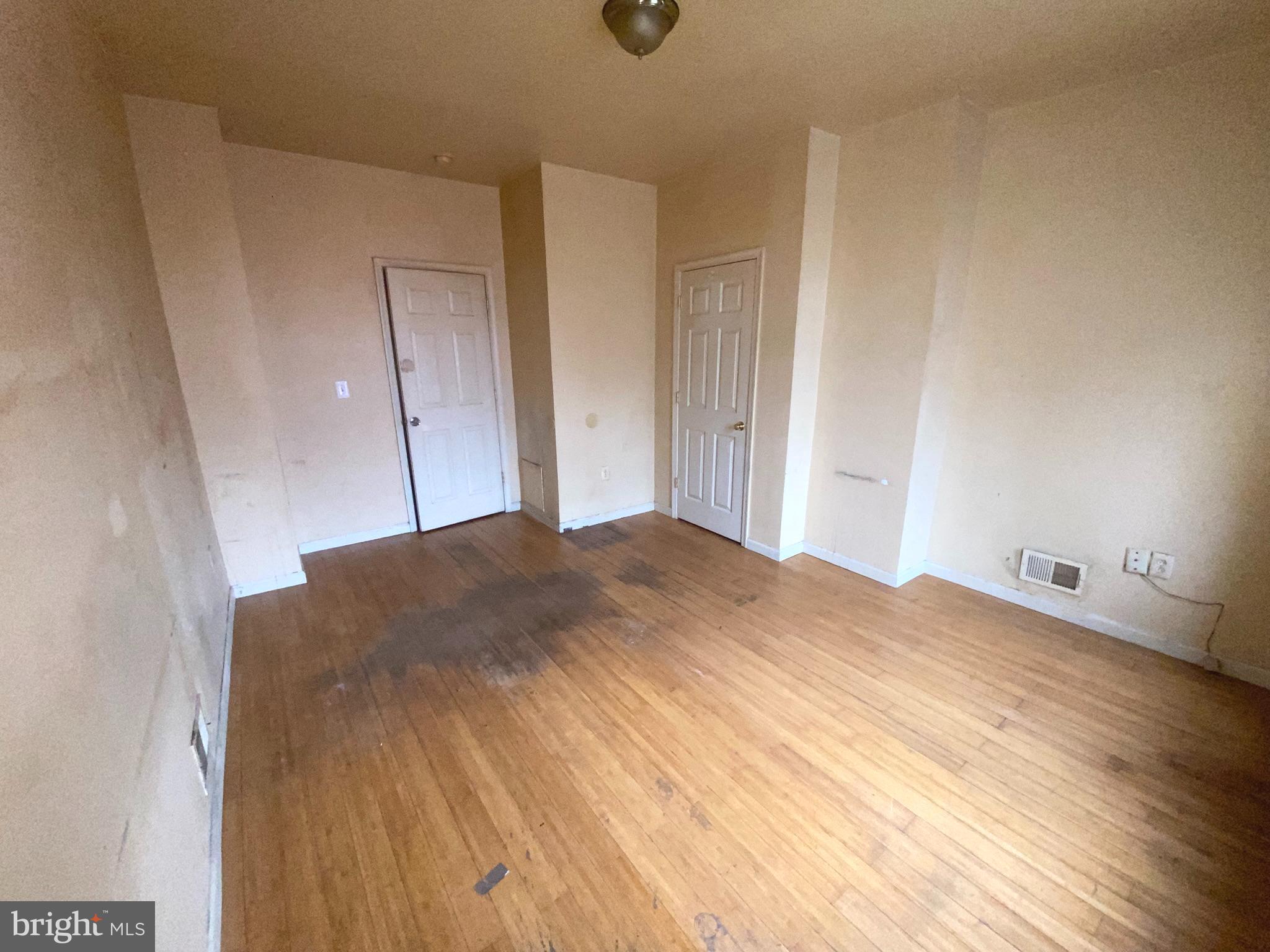 2221 Jefferson Street Baltimore, MD 21205 - Photo 12 of 29 a bedroom with a bed and a window