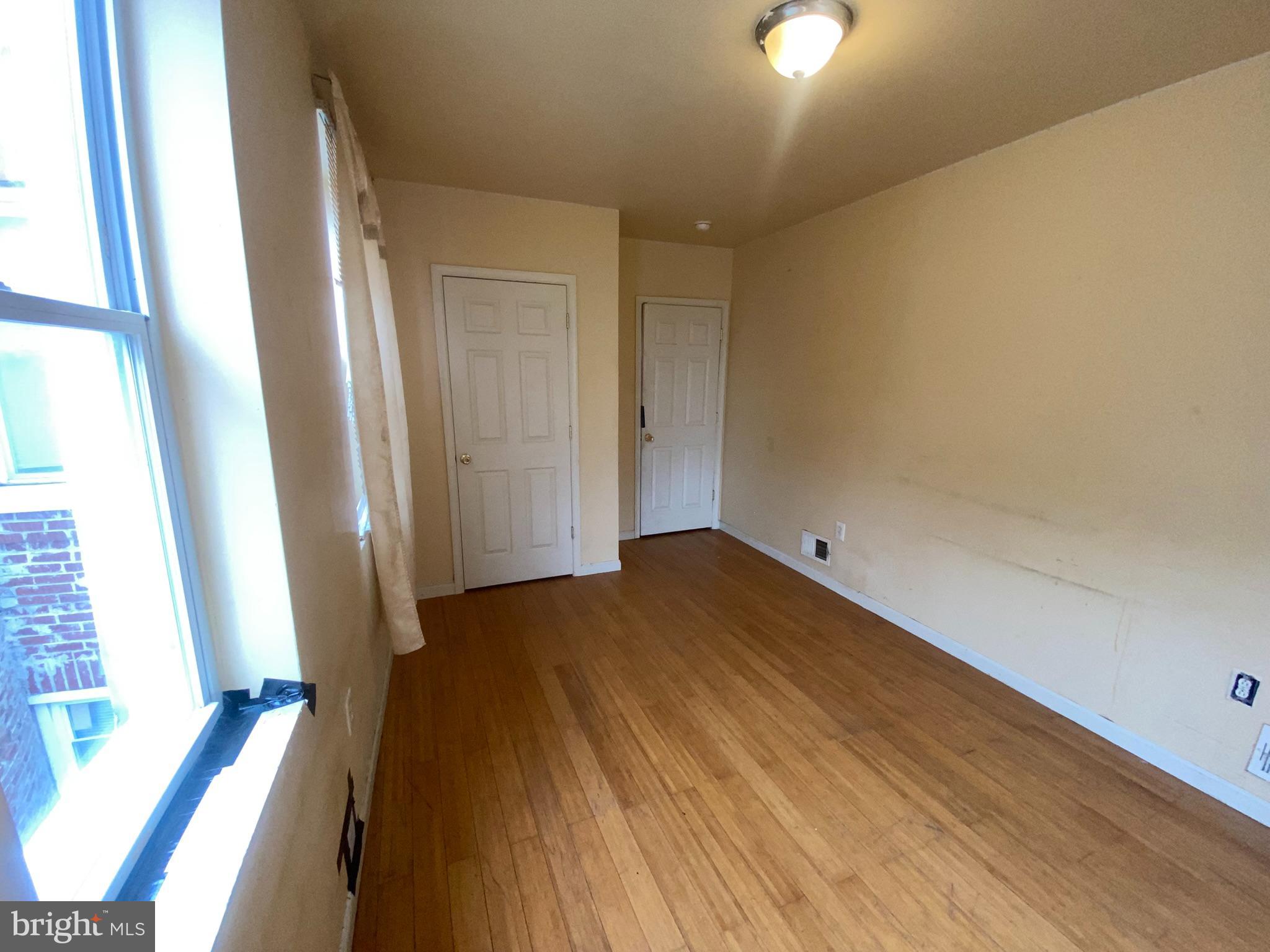 2221 Jefferson Street Baltimore, MD 21205 - Photo 16 of 29 a view of empty room with wooden floor