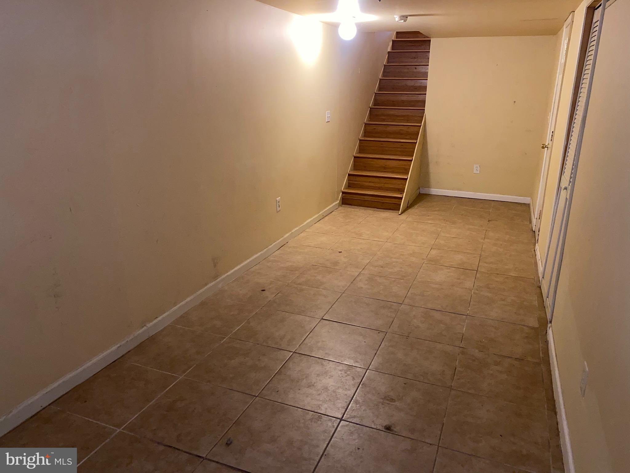 2221 Jefferson Street Baltimore, MD 21205 - Photo 19 of 29 a view of an empty room with stairs