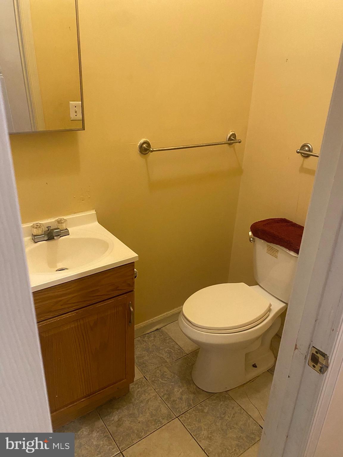 2221 Jefferson Street Baltimore, MD 21205 - Photo 8 of 29 a bathroom with a sink and a toilet