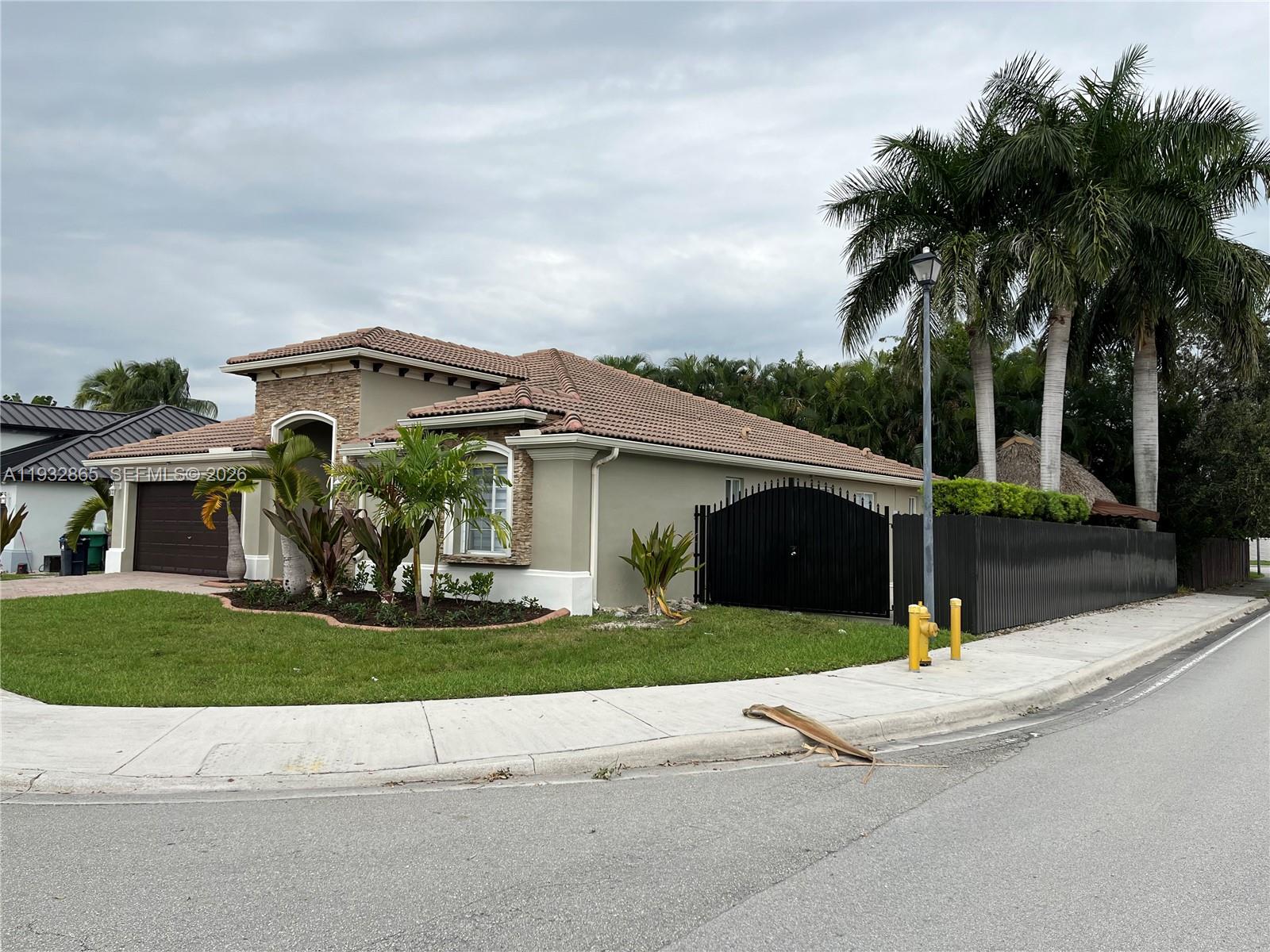 15205 Southwest 13th Terrace Miami, FL 33194 - Photo 2 of 12 a view of house and outdoor space with yard