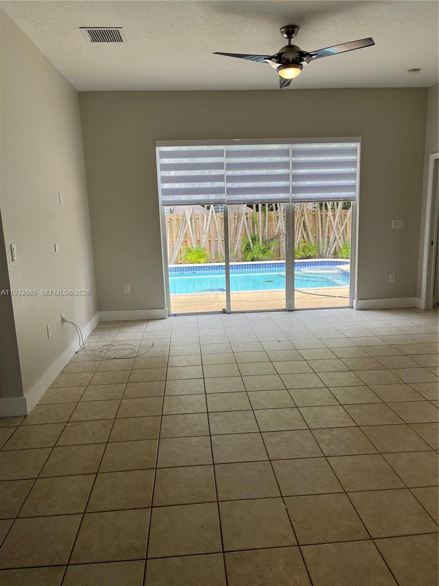 15205 Southwest 13th Terrace Miami, FL 33194 - Photo 9 of 12 a view of an empty room with a window