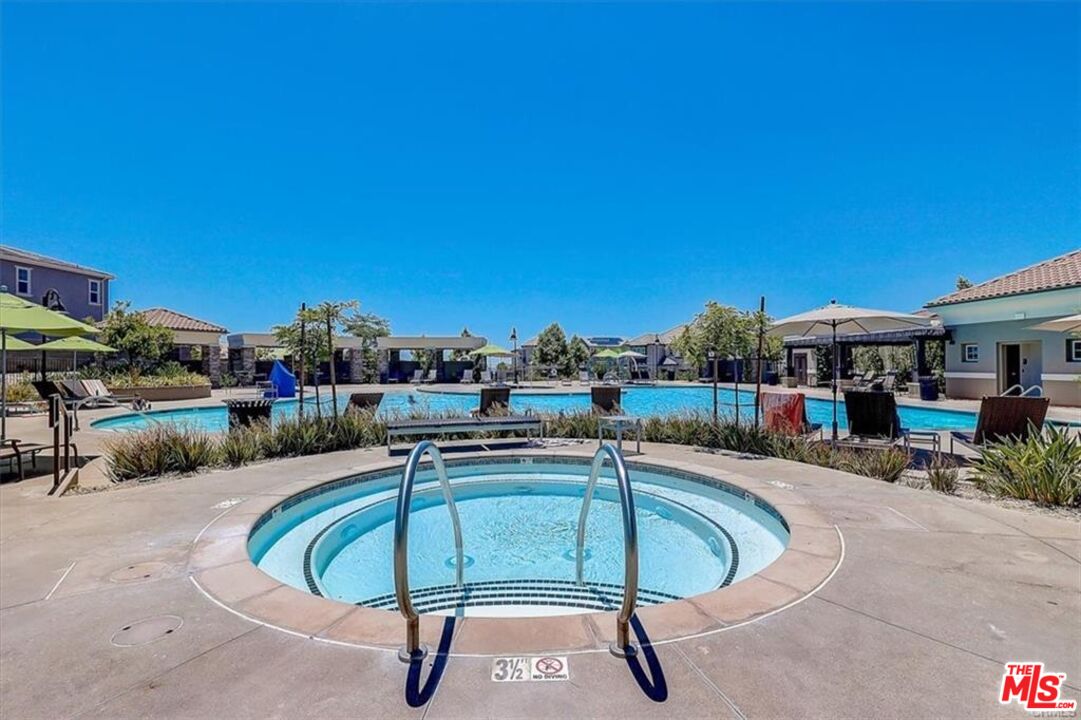 302 Limestone Lake Forest, CA 92610 - Photo 16 of 34 a swimming pool with outdoor seating and yard