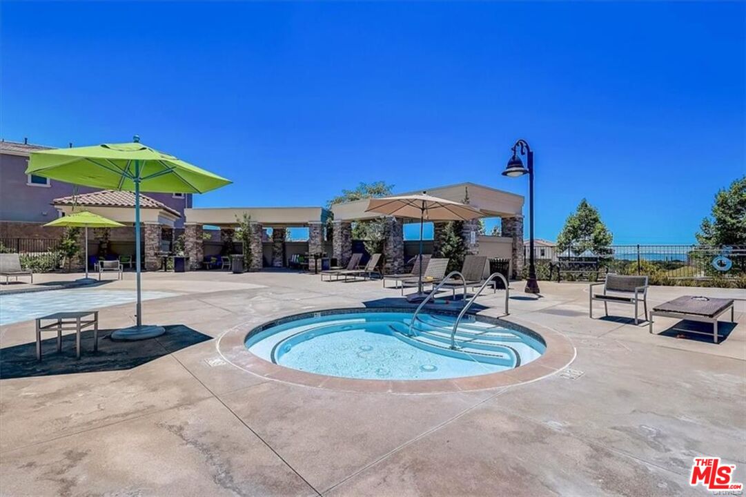 302 Limestone Lake Forest, CA 92610 - Photo 18 of 34 a swimming pool with outdoor seating yard