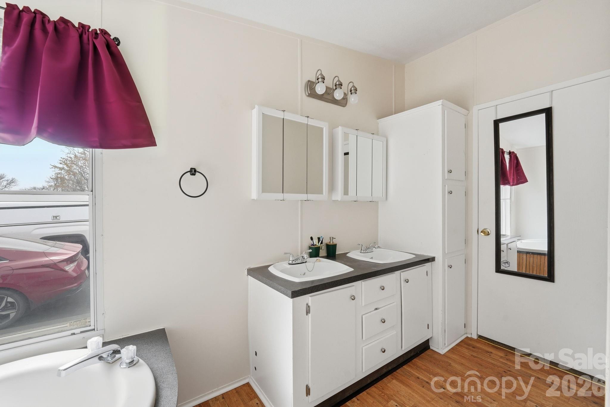 2862 Eagle Point Drive Trinity, NC 27370 - Photo 16 of 31 a bathroom with a sink and a mirror