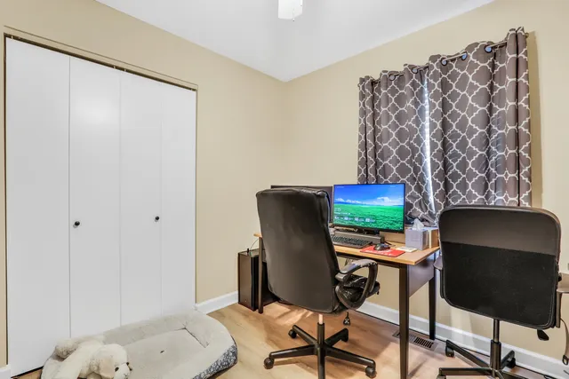 a workspace with furniture and a chair