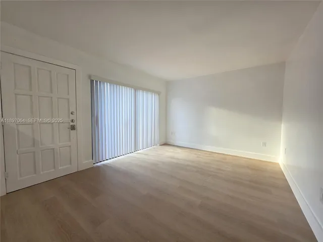 a view of an empty room and window