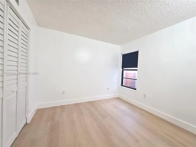 an empty room with a empty space and window