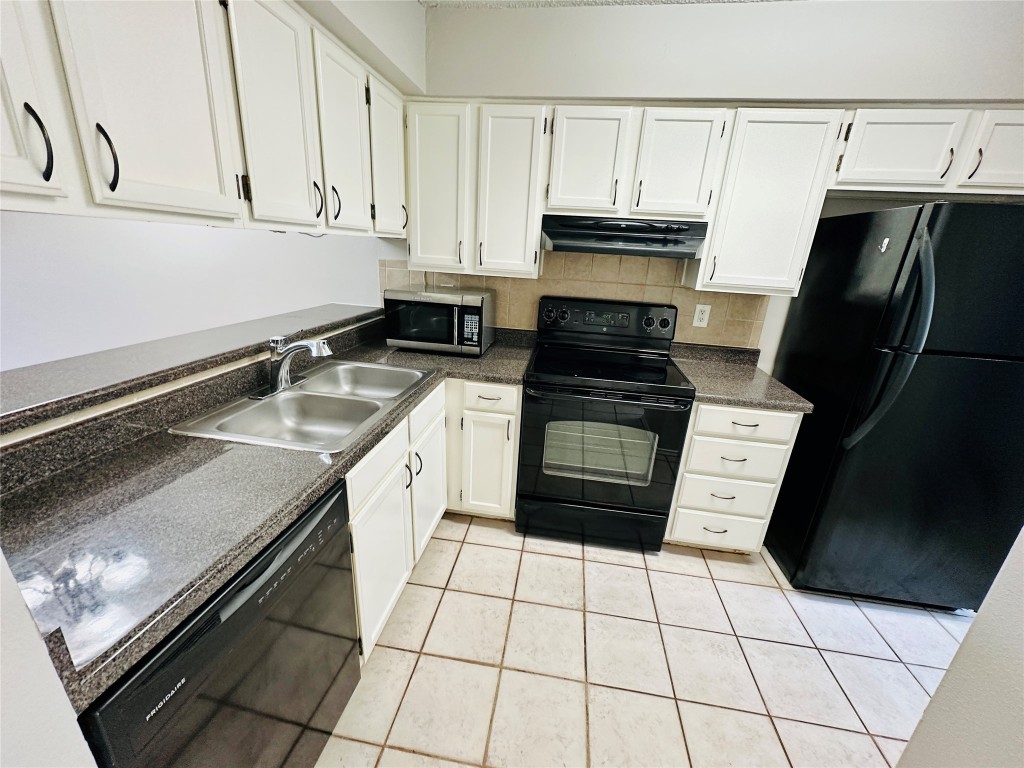 2215 Post Road, Unit 2028 Austin, TX 78704 - Photo 1 of 25 a kitchen with a sink and a stove top oven