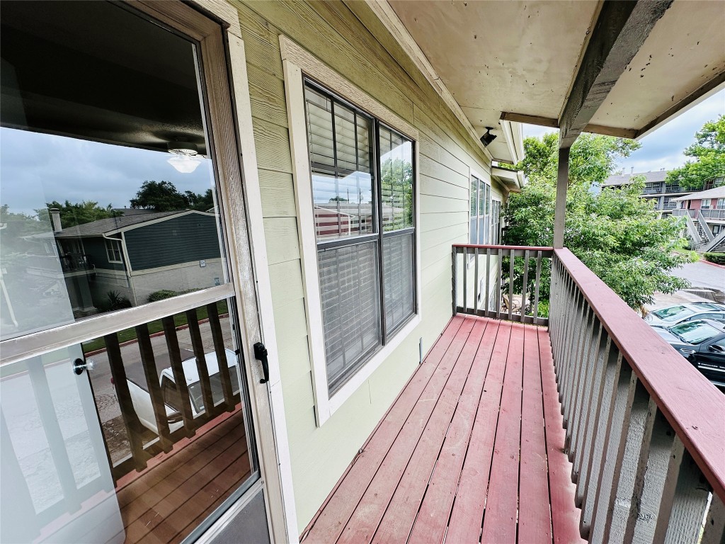 2215 Post Road, Unit 2028 Austin, TX 78704 - Photo 20 of 25 a balcony with wooden floor