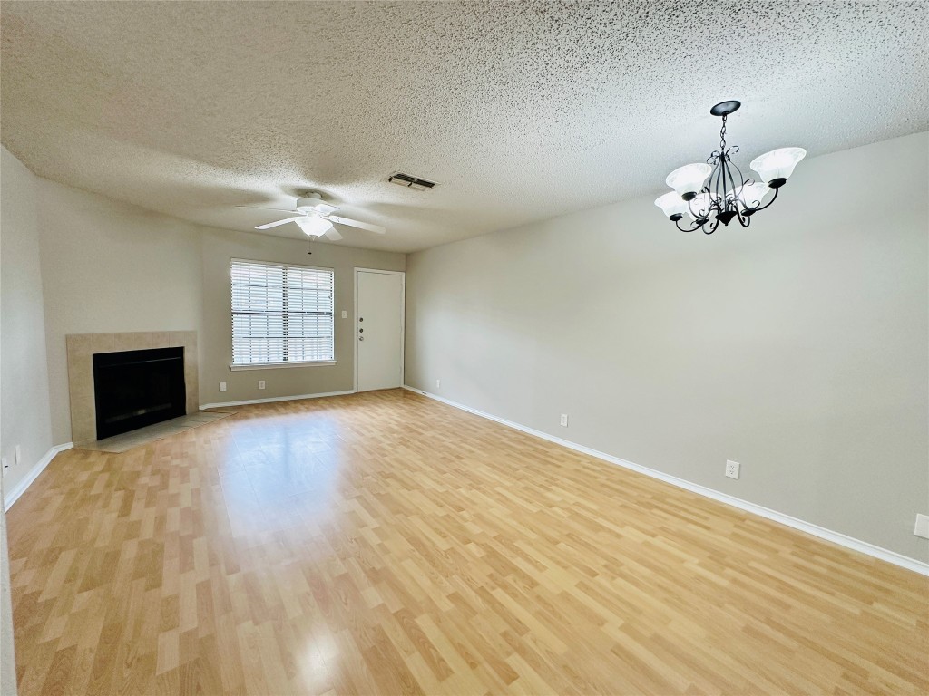 2215 Post Road, Unit 2028 Austin, TX 78704 - Photo 8 of 25 wooden floor in an empty room with a window