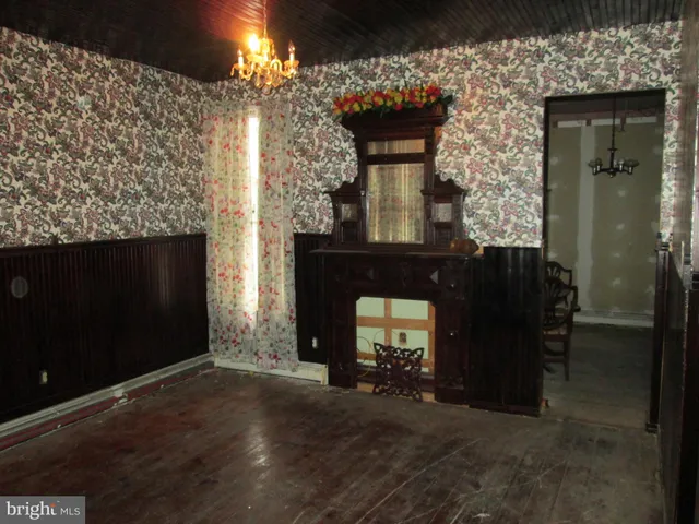 a view of a livingroom with furniture and a fireplace