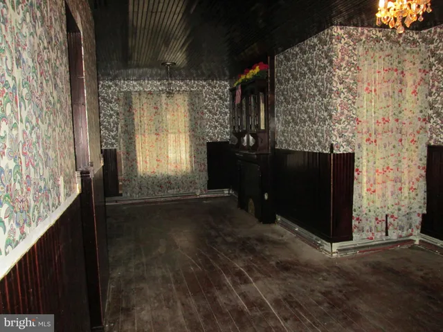 a view of empty room with windows