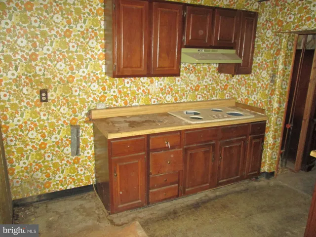 a bathroom with a granite countertop sink and a vanity