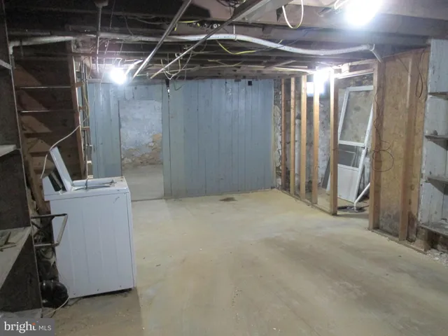 a bathroom with a granite countertop shower a stove and a sink