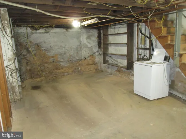 a view of a backyard with table and chairs