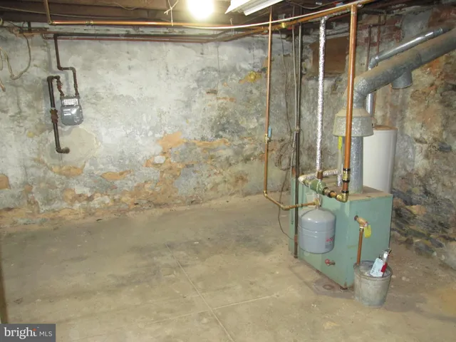 a view of a patio with table and chairs and potted plants