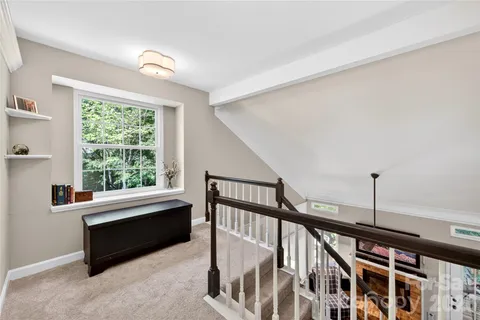 a bedroom with furniture and a window