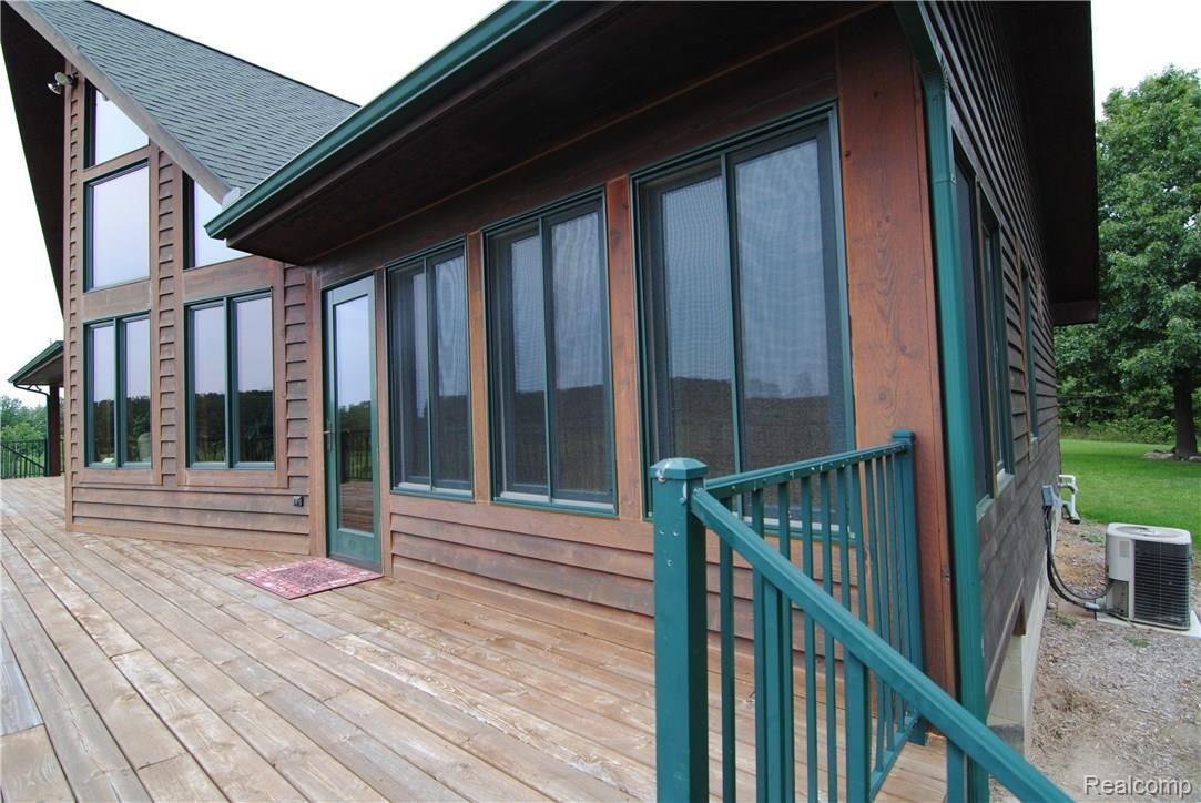 2497 East Clyde Road Howell, MI 48855 - Photo 13 of 95 Door to 3-Season Rm with entrance to bdrm too.