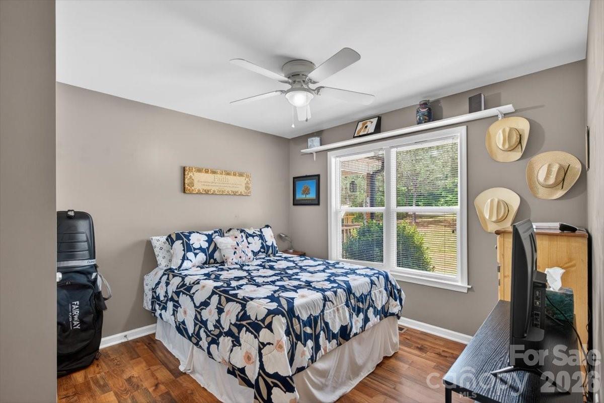 567 Godbey Road Mocksville, NC 27028 - Photo 12 of 38 a bed sitting in a bedroom next to a window