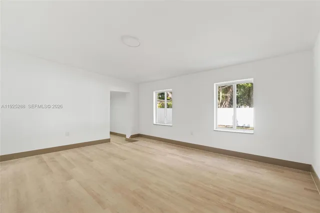 an empty room with windows