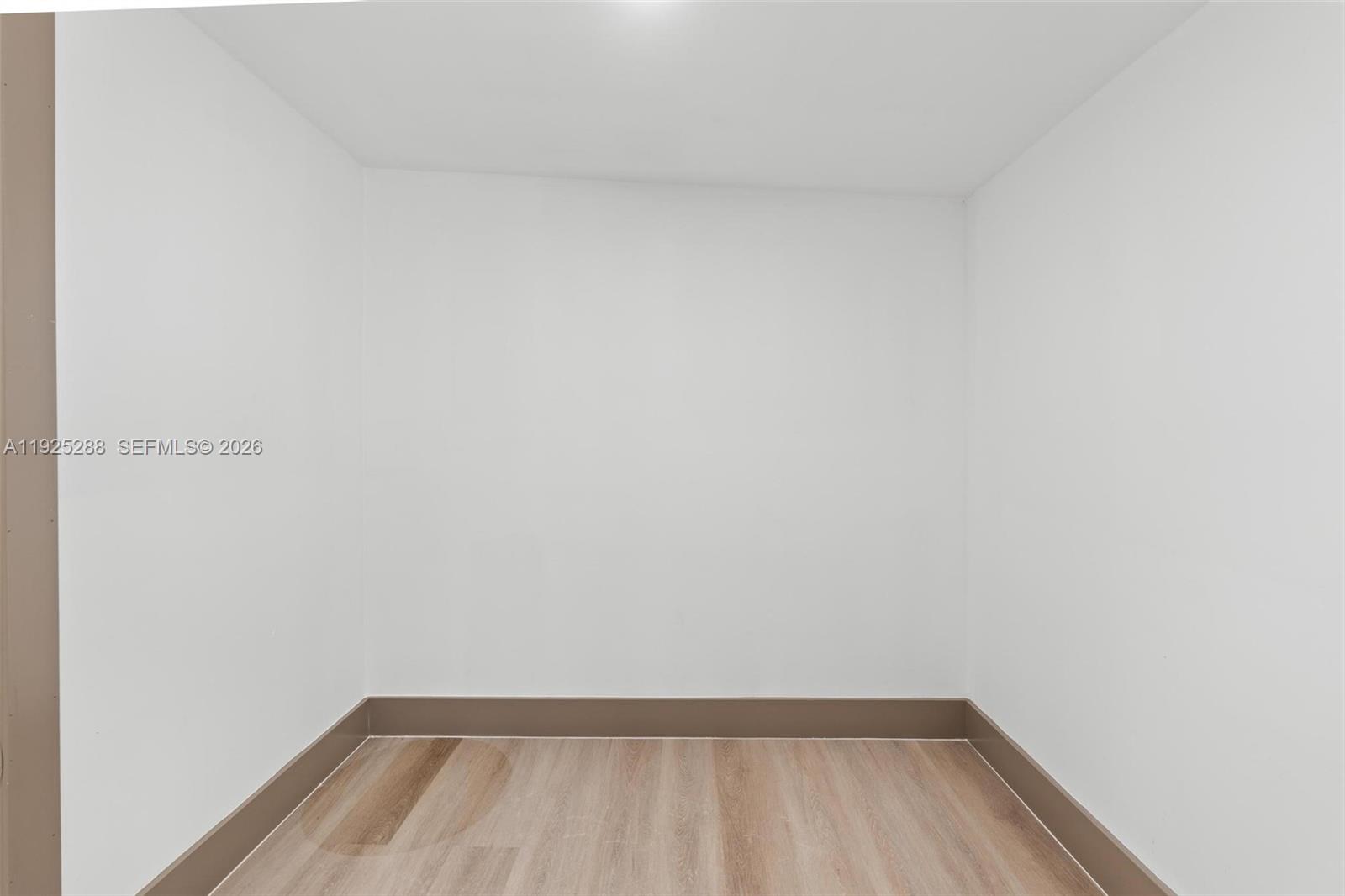 1453 Northwest 56th Street Miami, FL 33142 - Photo 17 of 29 a view of wooden floor in a small bathroom