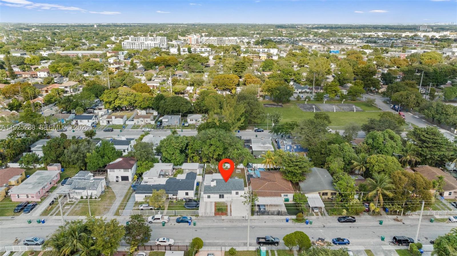 1453 Northwest 56th Street Miami, FL 33142 - Photo 26 of 29 an aerial view of residential houses with outdoor space