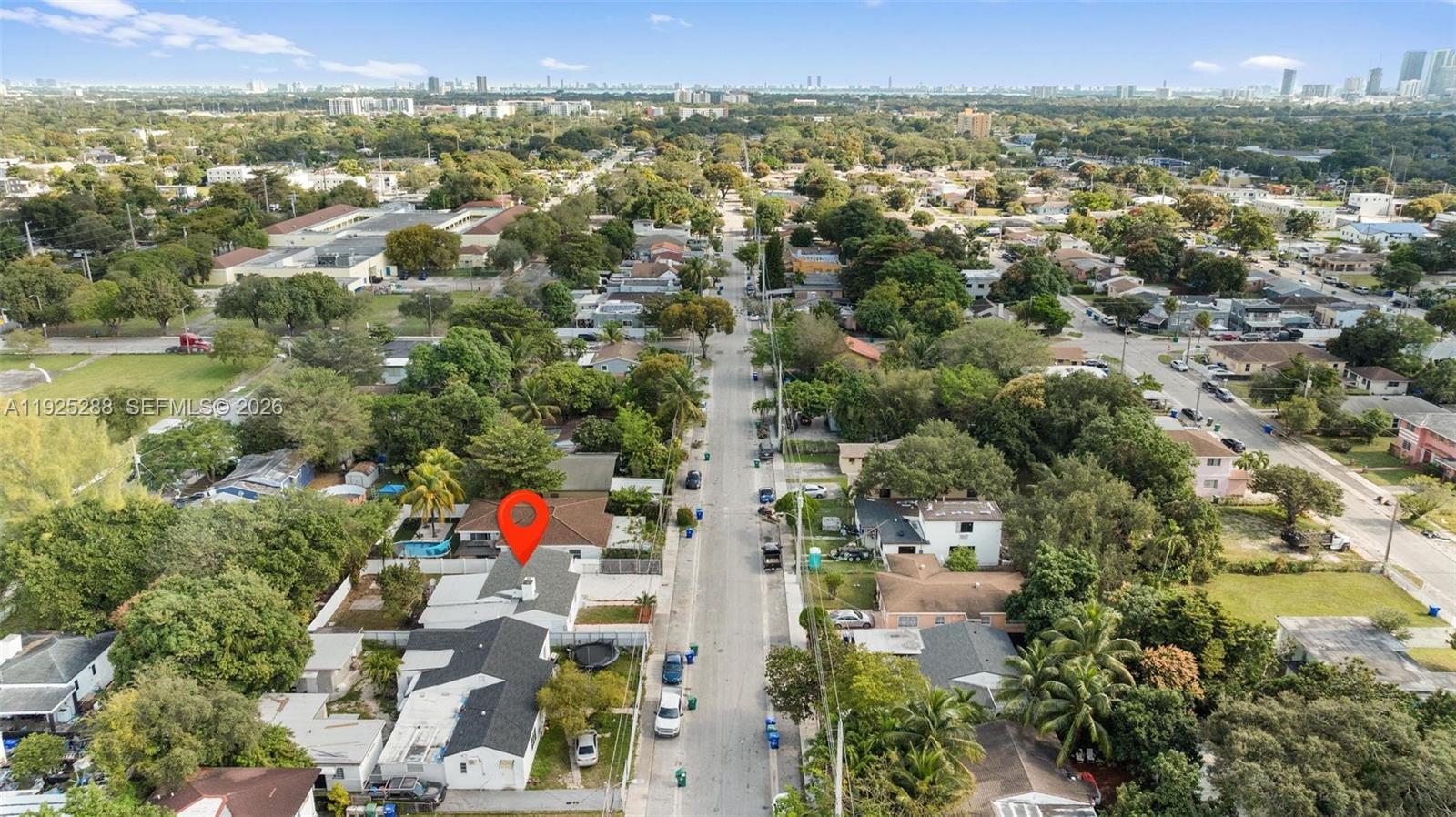 1453 Northwest 56th Street Miami, FL 33142 - Photo 27 of 29 an aerial view of residential houses with outdoor space and swimming pool