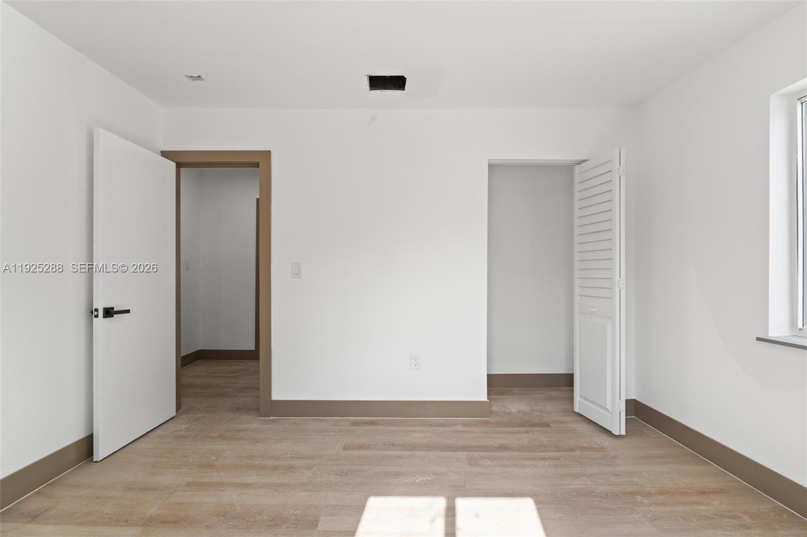 1453 Northwest 56th Street Miami, FL 33142 - Photo 10 of 29 a view of an empty room