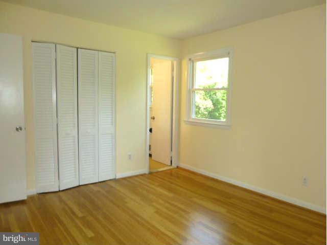 2225 Forest Glen Road Silver Spring, MD 20910 - Photo 15 of 30 a view of an empty room with wooden floor and a window