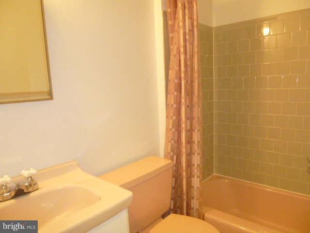2225 Forest Glen Road Silver Spring, MD 20910 - Photo 16 of 30 a bathroom with a sink and a toilet
