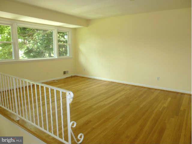 2225 Forest Glen Road Silver Spring, MD 20910 - Photo 4 of 30 a view of a room with wooden floor and a window