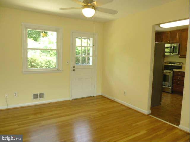 2225 Forest Glen Road Silver Spring, MD 20910 - Photo 7 of 30 a view of empty room with wooden floor and fan