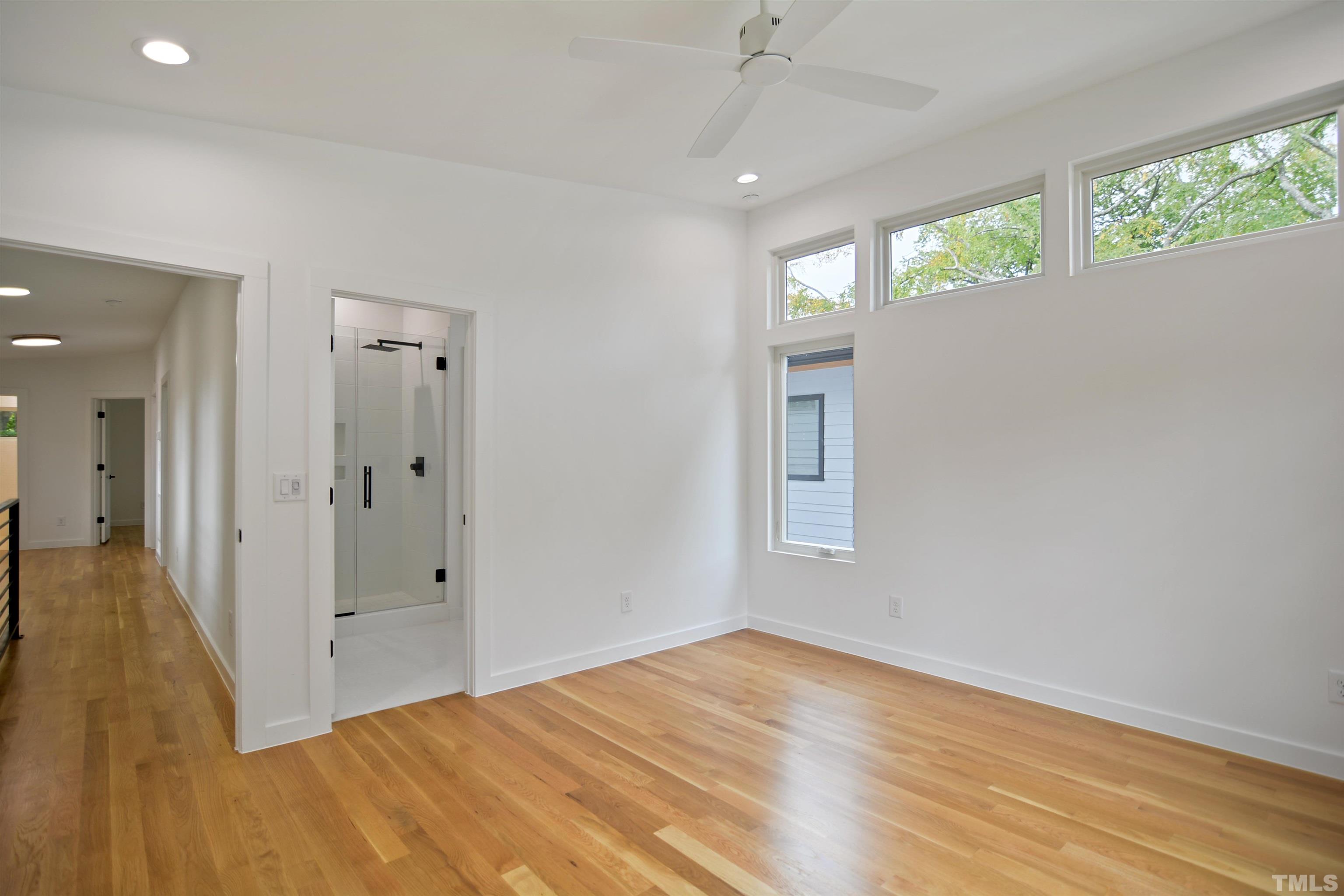 1306 East Lenoir Street Raleigh, NC 27610 - Photo 14 of 26 wooden floor in an empty room with a window